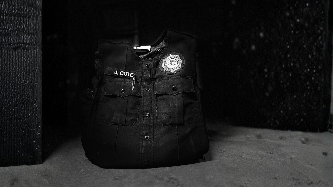 A federal employee’s uniform vest hanging in quiet light, symbolizing faith and resilience during uncertainty — a reminder that what can’t be shut down is the strength built on trust in God.